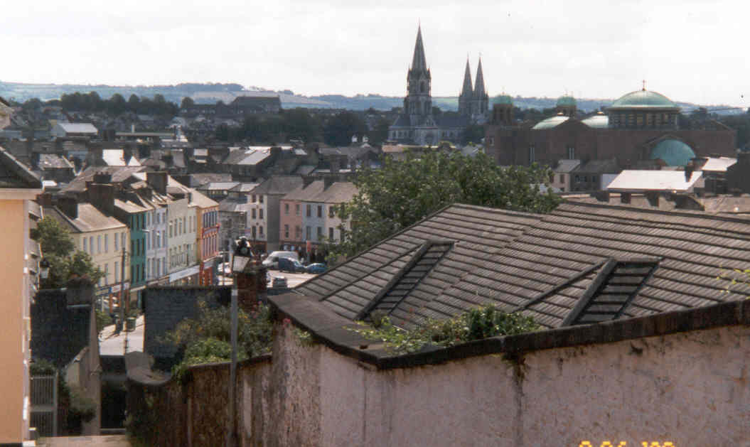 The view directly south from the Shandon hill of town, looking across at the 19th Century St. Finbarr's Cathedral, and a modern brick church so ugly it doesn't even deserve to have it's name known.