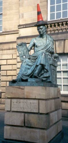 I have no idea why the Scottish philosopher Hume is wearing a toga in this statue, but the traffic cone seems to suit him. (High Street, Edinburgh)