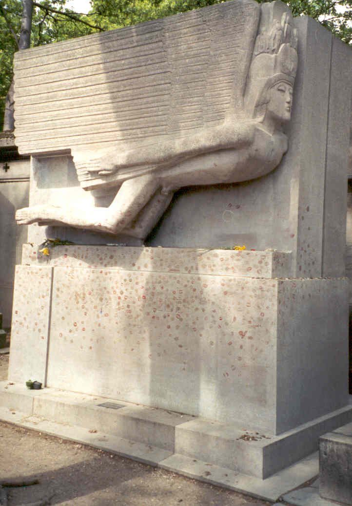 Oscar Wilde's three meter tall tomb. Apparently, that angel was originally so 'obscene' that they had to neuter it, rather crudely. If you're wondering what those red splotches are, they're lipstick kisses.